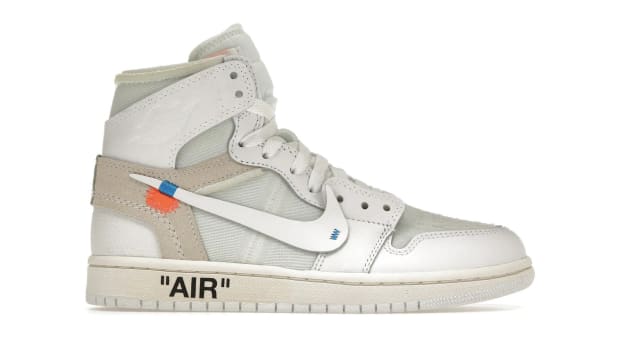 Side view of a yellow and white Air Jordan sneaker.